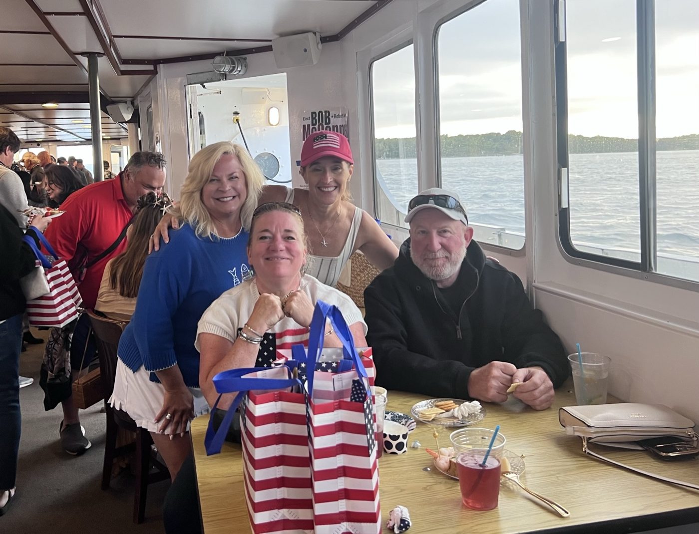 Attendees at a table aboard the canal cruise